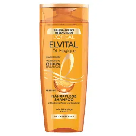 L'image montre un flacon de L'Oréal Paris Elvital Shampoing Öl Magique Soin Nourrissant Cheveux Secs 250 ml, parfait pour les cheveux secs. Son emballage orange vif met en valeur le texte allemand et français, avec une nouvelle formule et du plastique 100 % recyclé. Inspiré du charme vivant de Dakar, il revitalise vos cheveux. Dakar